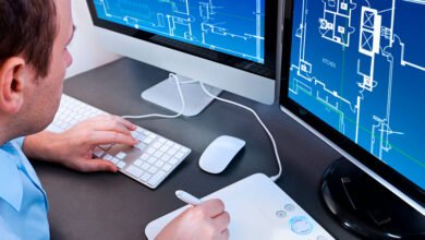 A picture of a person, working on the computer.