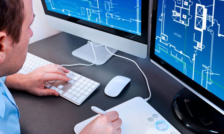 A picture of a person, working on the computer.