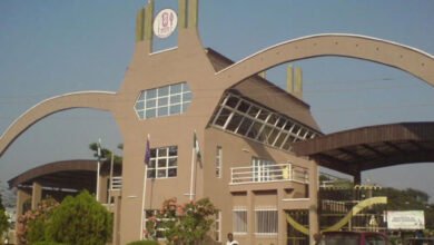 Students obstruct the entrance to UNIBEN in protest of the ongoing ASUU warning strike.